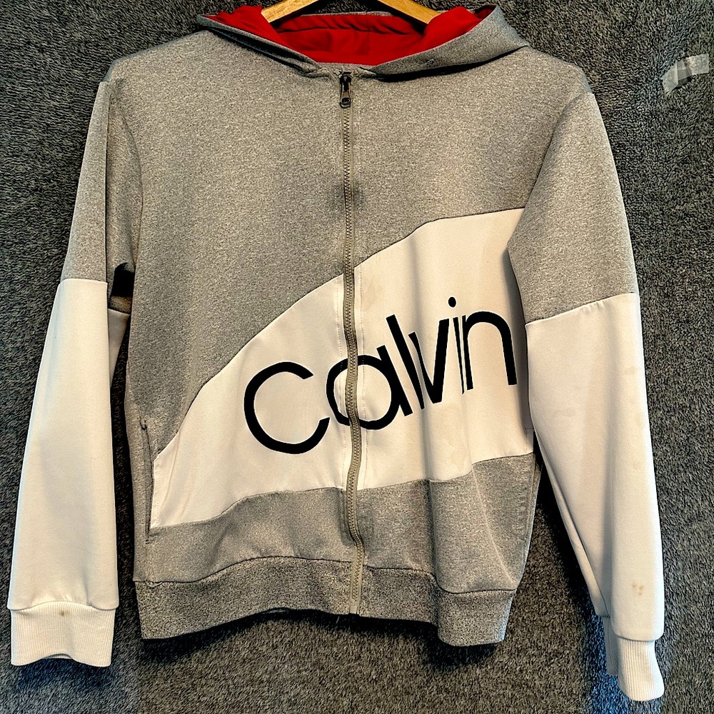 Calvin Klein zip up hoodie. Size Small. Light gray, white and red.